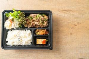 Japanese rice with pork yaki bento set photo