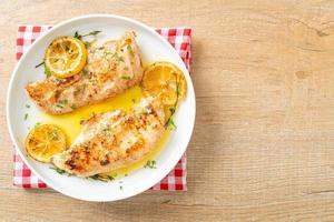 grilled chicken with butter, lemon and garlic photo