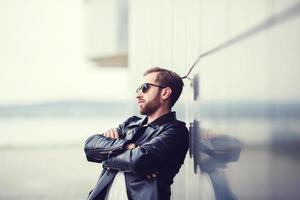 Fashionable man in leather jacket photo