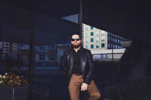 young beard man posing in the street photo