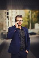 businessman with smartphone talking photo