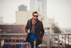 young handsome man in sunglasses photo