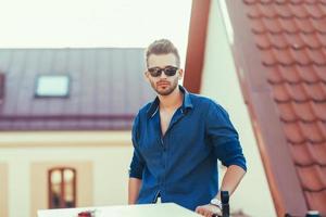 Stylish man standing in street wearing shirt photo