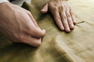 Tailor working in his tailor shop photo