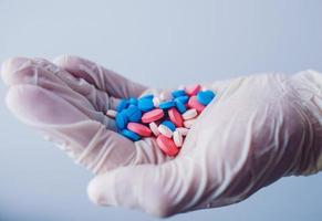 Medicine doctor holding a color pills photo