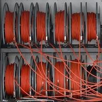 Coils of red electric cable. Reels of cable. photo