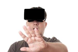 man wearing VR virtual reality headset reaching out photo