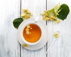 cup of herbal tea with linden flowers photo