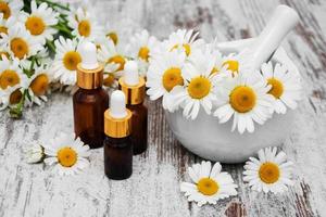 Essencial oil and camomile photo