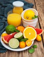 Juice and fresh citrus fruits photo