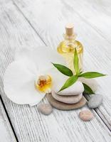 Spa products and white orchids photo