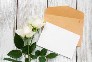 White roses and envelope photo