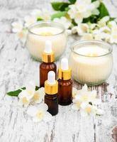 Massage oils and jasmine flowers photo