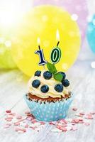 Cupcake with a numeral ten candle photo