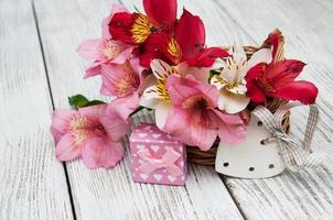 pink alstroemeria with gift box photo