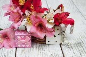 pink alstroemeria with gift box photo