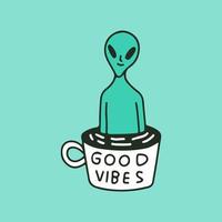 extraterrestre divertido en una taza de café con tipografía de buenas vibraciones, ilustración para camisetas, pegatinas o prendas de vestir. con estilo de dibujos animados retro. vector