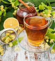 cup of herbal tea with linden flowers photo