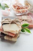 Handmade soap bars and green leaves photo