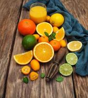 Fresh citrus fruits and old juicer photo