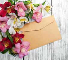 paper envelope with alstroemeria flowers photo