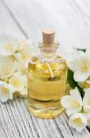 Massage oil with jasmine flowers photo