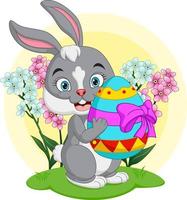 Cute little bunny holding an easter egg vector