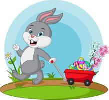 Cute little bunny carrying a cart with easter eggs vector