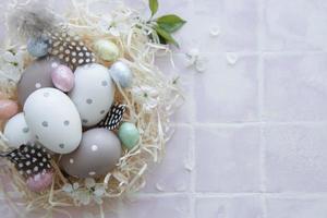 Easter eggs in straw nest photo