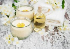 Massage oil and jasmine flowers photo