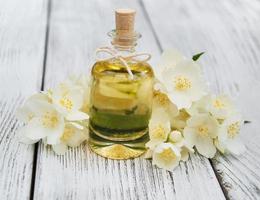Massage oil with jasmine flowers photo