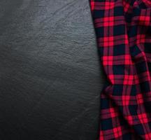 Checkered napkin on a black background photo