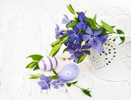 bucket with  periwinkle and easter eggs photo