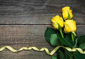 Yellow roses on a table photo