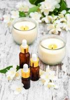 Massage oils and jasmine flowers photo