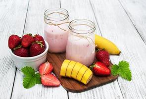 yogurt with fresh strawberries and banana photo