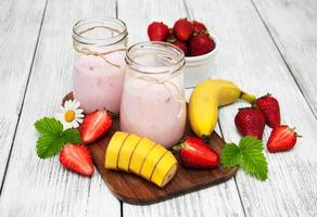 yogurt with fresh strawberries and banana photo