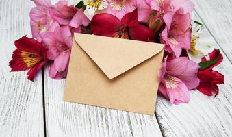 paper envelope with alstroemeria flowers photo