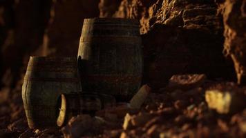 old wooden vintage wine barrels near stone wall in canyon video