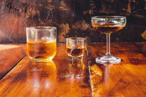 liquor glass on wooden table photo