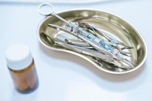 dental instruments are on a white table photo