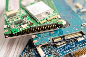Technician repairing inside of mobile phone by soldering iron. Integrated Circuit. the concept of data, hardware, technology. photo