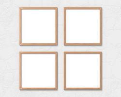 Set of 4 square wooden frames mockup hanging on the wall. Empty base for picture or text. 3D rendering. photo