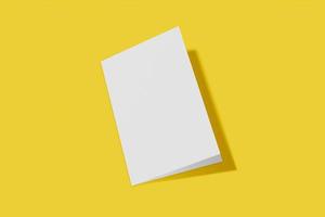 Mockup vertical booklet, brochure, invitation isolated on a yellow background with hard cover and realistic shadow. 3D rendering. photo