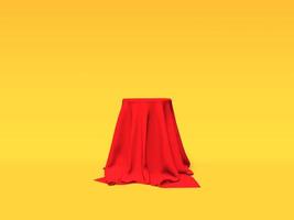 podio, pedestal o plataforma cubierta con tela roja sobre fondo amarillo. ilustración abstracta de formas geométricas simples. representación 3d foto