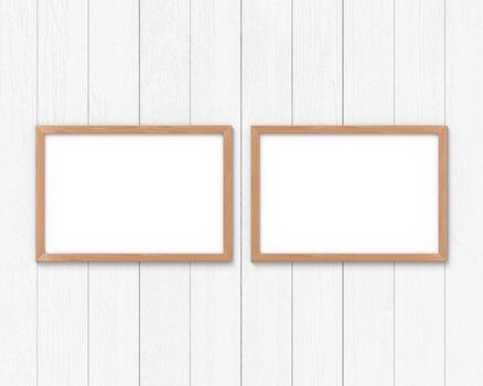 Set of 2 horizontal wooden frames mockup hanging on the wall. Empty base for picture or text. 3D rendering. photo