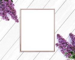 Rose gold frame mockup on a wooden painted white background. 4x5 Portrait. photo