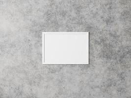 White horizontal picture frame on the background of a concrete wall. Grunge interior. 3D rendering. photo