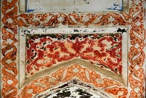 Elements of ancient architecture of Central Asia. Ceiling in the form of a dome in a traditional ancient Asian mosaic photo
