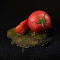 tomatoes on a black background photo